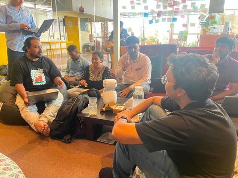 Attendees mid-discussion at Issue 01